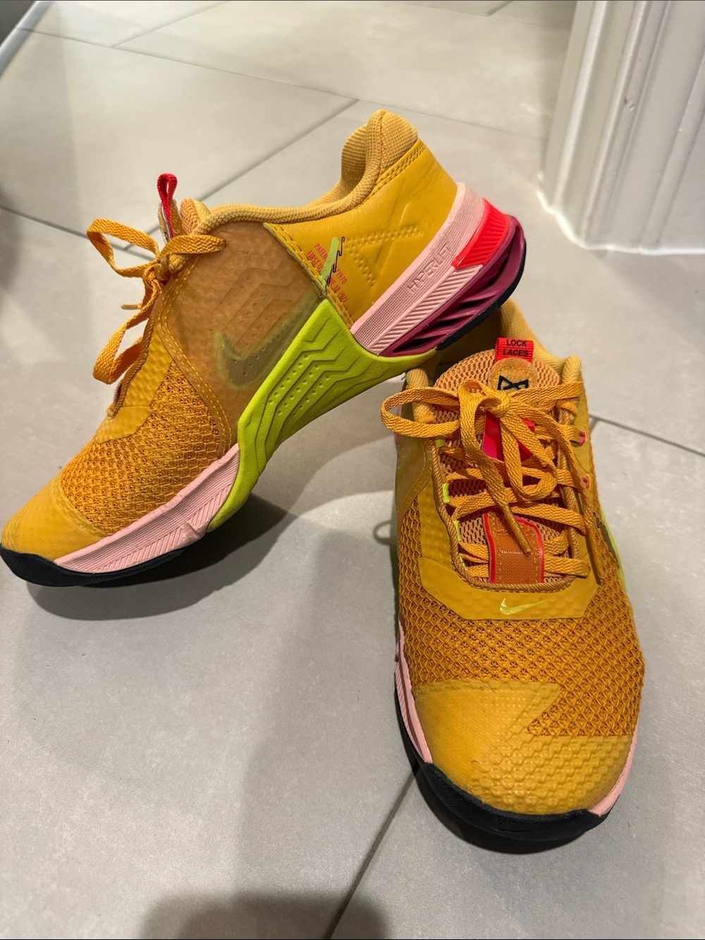 Nike Women's Yellow Running Shoes with Multicolor Sole Accents